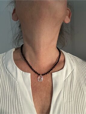 Faceted Black Bead Necklace with Clear Teardrop Pendant